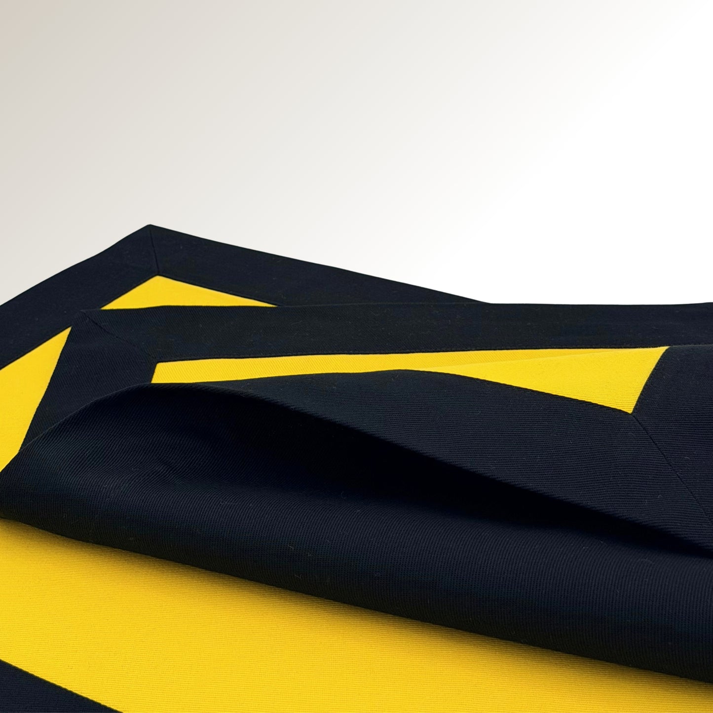 Black and yellow signature placemat.