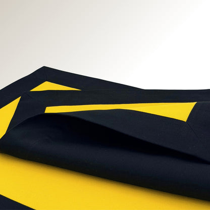 Black and yellow signature placemat.